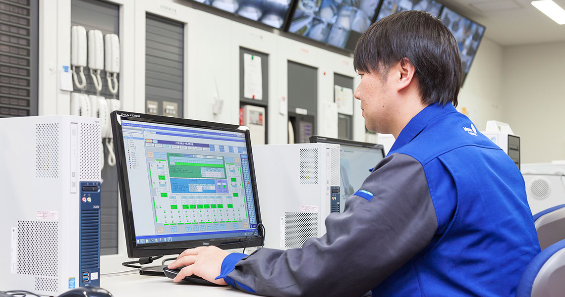 worker sitting at computer station working
